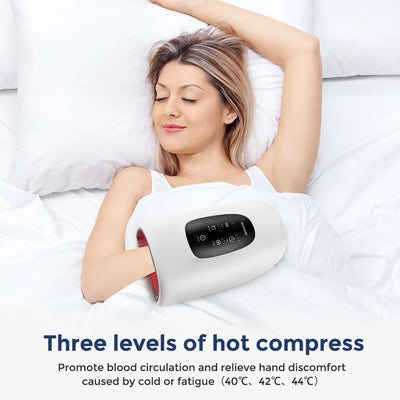 Woman relaxing with electric hand massager, featuring three hot compress levels for hand comfort and improved circulation.