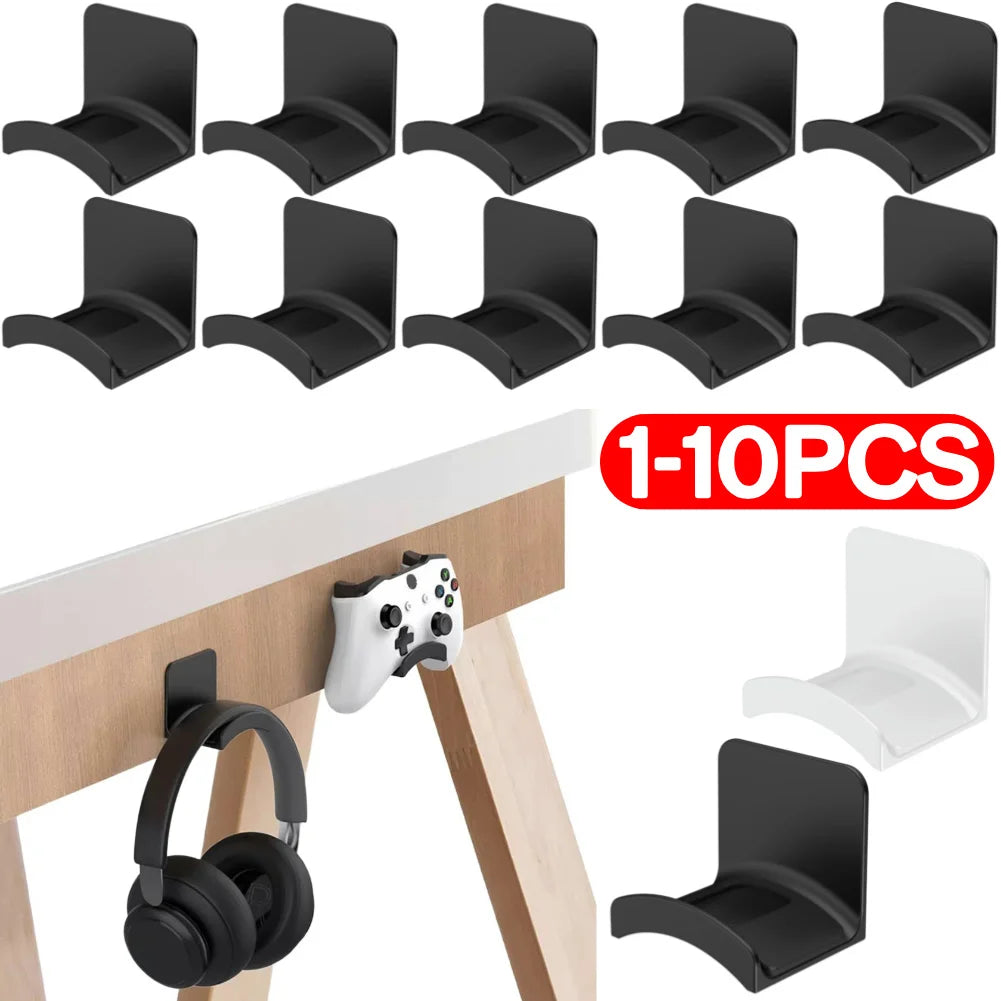 Universal adhesive headphone hangers in black and white, perfect for desk or wall mounting, damage-free storage.