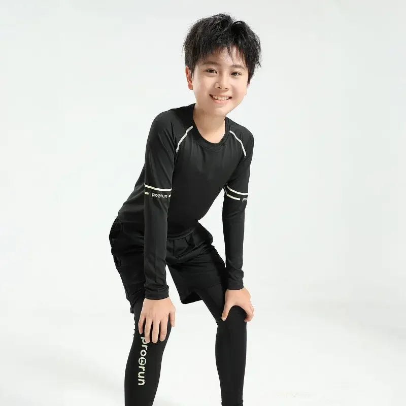 Boys' thermal compression sportswear set in black, perfect for basketball and soccer, designed for comfort and quick-dry performance.
