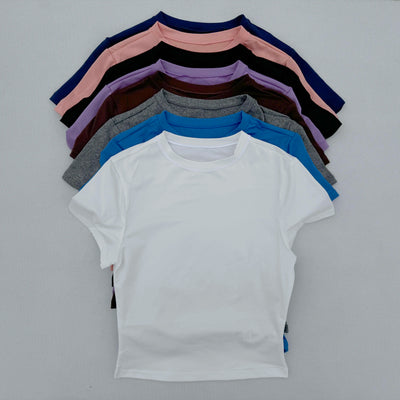 Collection of women's short-sleeved sports T-shirts in various colors, quick-drying and breathable fabric.