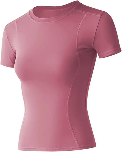 Women's short sleeve workout top in pink, breathable nylon fabric for yoga and athletic activities.