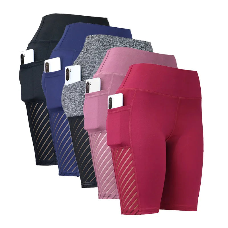 Collection of women’s knee-length yoga shorts in various colors, featuring side pockets and high waist design for fitness.