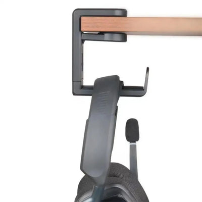 PC gaming headphone stand with adjustable clamp, showcasing black headset and durable metal mount on wood desk.