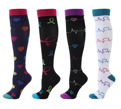 Four pairs of colorful compression socks with heart and ribbon designs, ideal for varicose veins and sports.