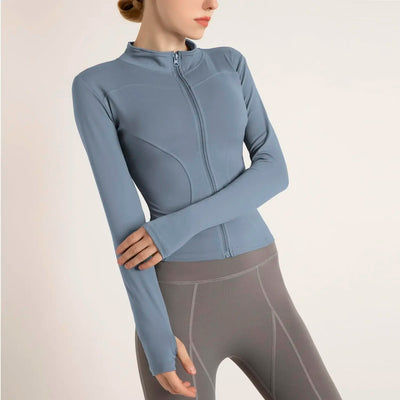Women's lightweight blue zip-up jacket, ideal for yoga and gym workouts, featuring breathable and quick-dry fabric.