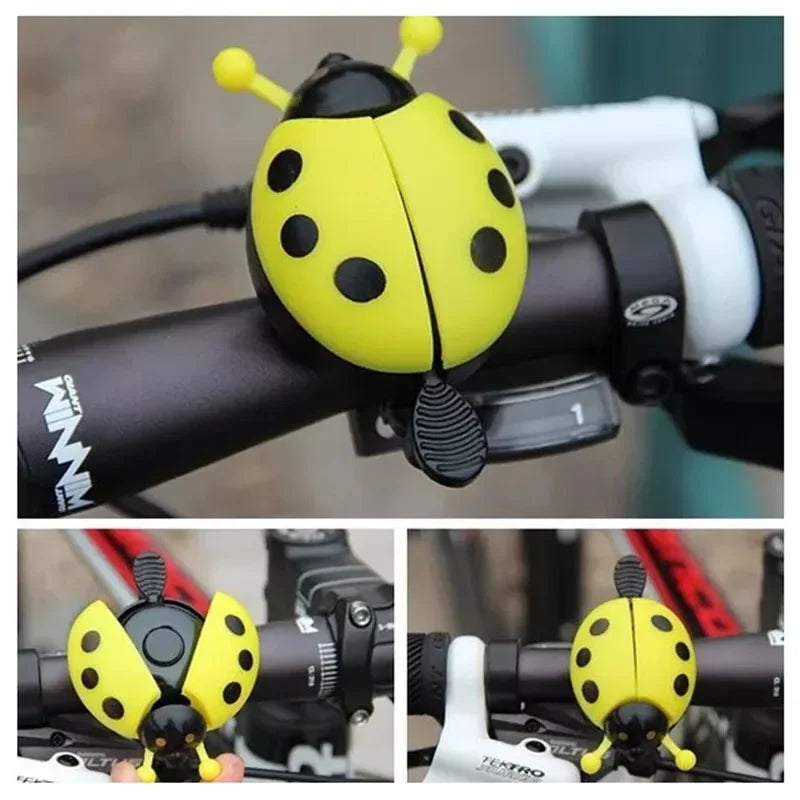 Cartoon ladybug bike bell in yellow and black, a cute mini bicycle horn for kids and girls on bike handlebars.