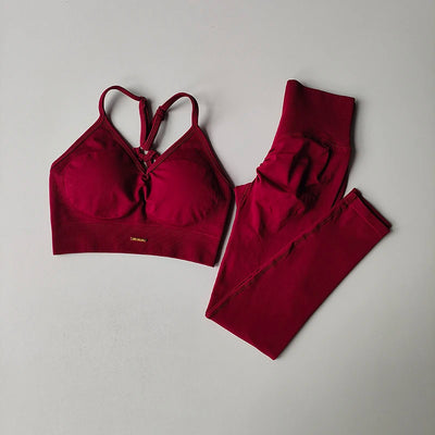 Seamless women's yoga set featuring a V-neck bra and hip-lift leggings in vibrant red for fitness and toning.