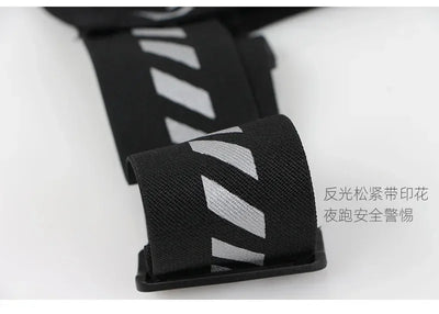 Close-up of reflective strap on running vest for safety during nighttime sports.