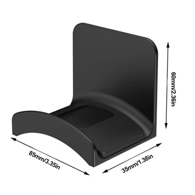 Universal adhesive headset hanger in black, perfect for mounting headphones on walls or desks, designed for easy access.