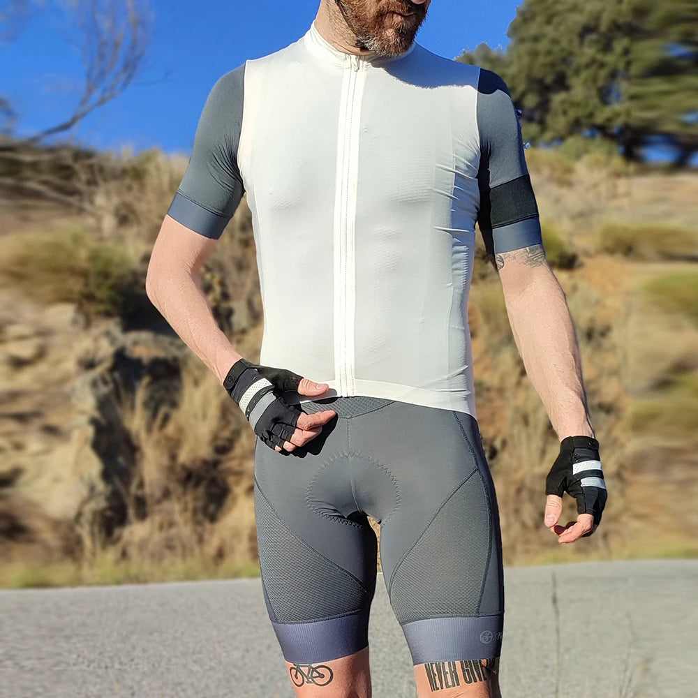 Man wearing YKYWBIKE cycling bib shorts and jersey, ideal for outdoor bike rides, showcasing sporty design and comfort.