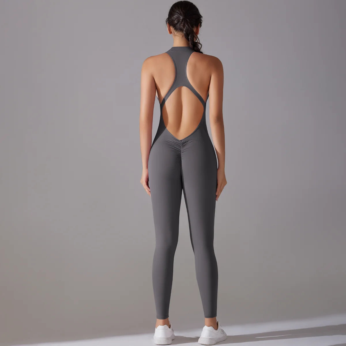 Women back view of gray bodysuit with tummy control and butt lifting features, perfect for yoga and workouts.