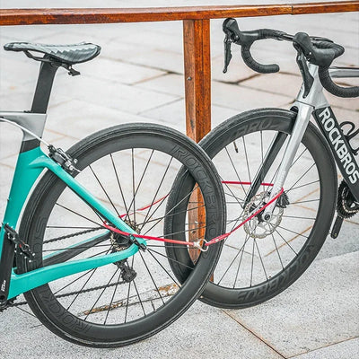 ROCKBROS high-security bike lock securing two bicycles together on urban street