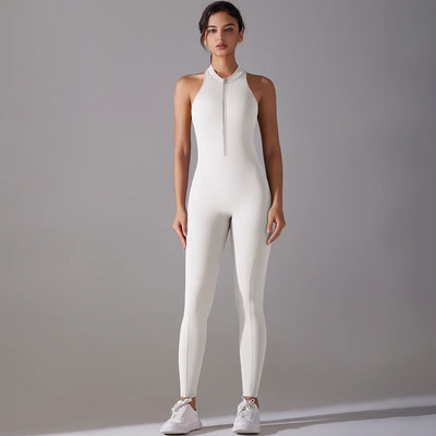 Woman wearing a white bodysuit with zip, ideal for yoga and fitness, showcasing tummy control and butt lifting features.