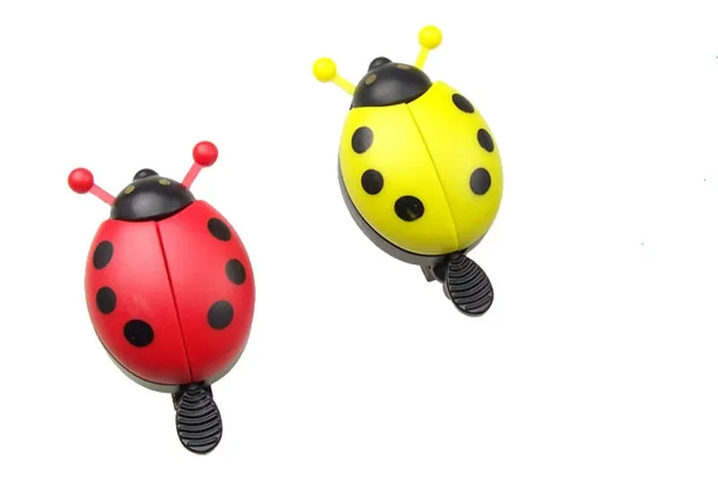 Cartoon ladybug bike bell set in red and yellow for kids' bicycles, durable plastic and aluminum alloy design.