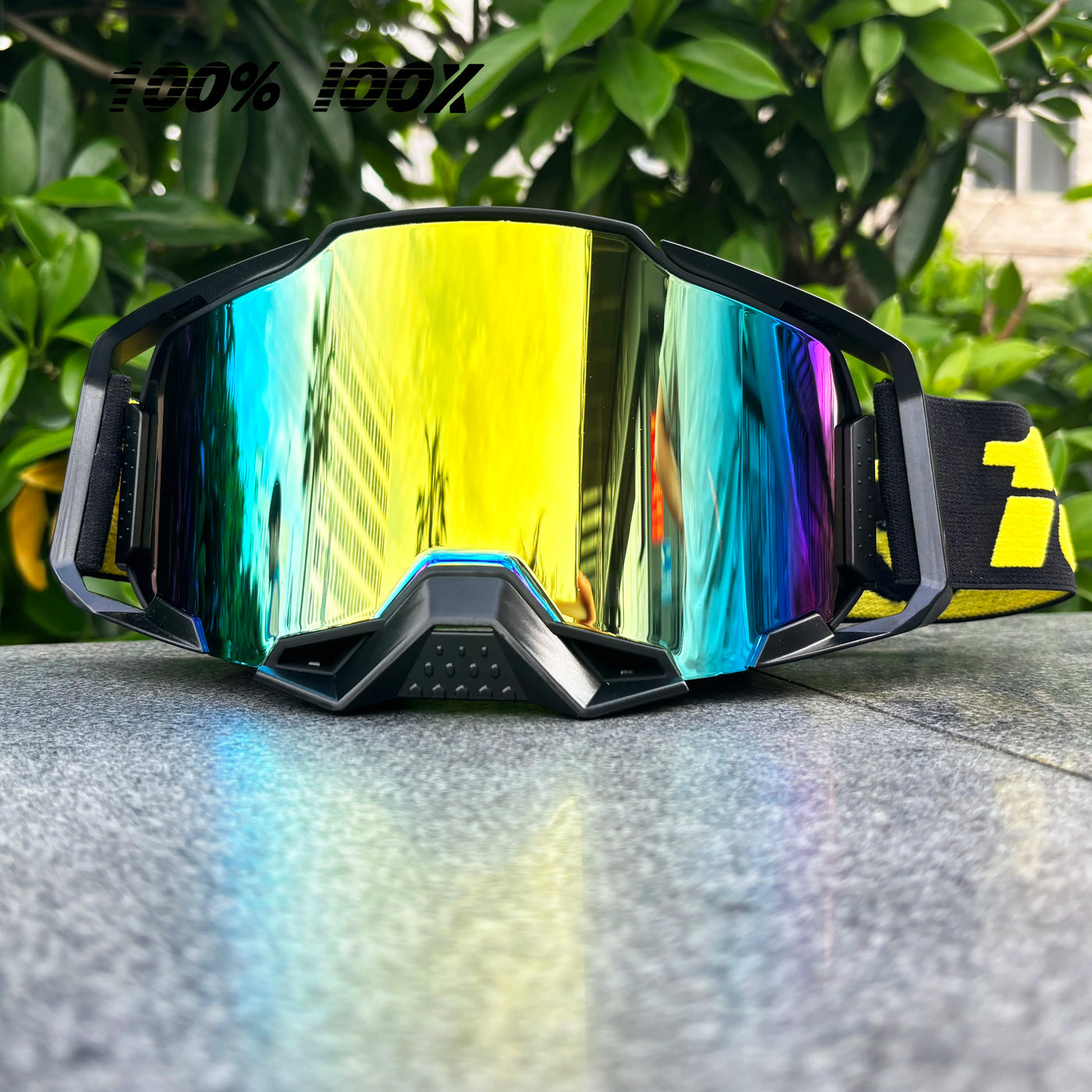 Colorful 100% IOOX motorcycle goggles designed for off-road MTB and dirt bike racing, showcasing high visibility lenses.