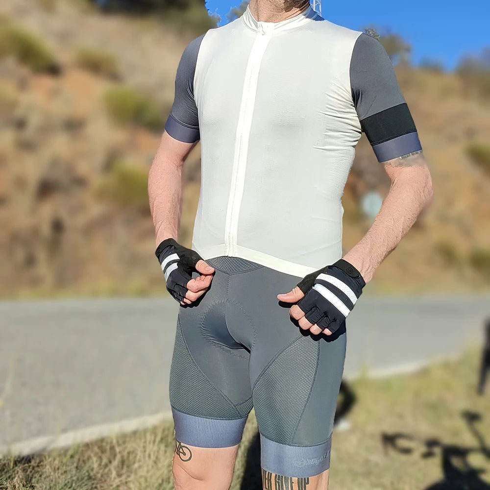 Man wearing YKYWBIKE cycling bib shorts and shirt, ideal for long bike rides in outdoor settings.