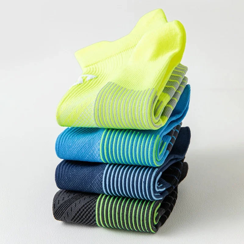 Stack of colorful breathable sports socks for men and women, perfect for running and fitness activities.