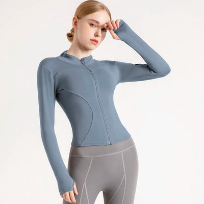 Women's lightweight sports jacket in blue, featuring a zip front and long sleeves, perfect for workouts and running.