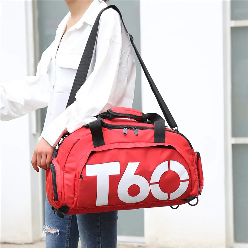 Red waterproof gym bag with T60 logo, designed for fitness and outdoor activities, ideal for men and women.
