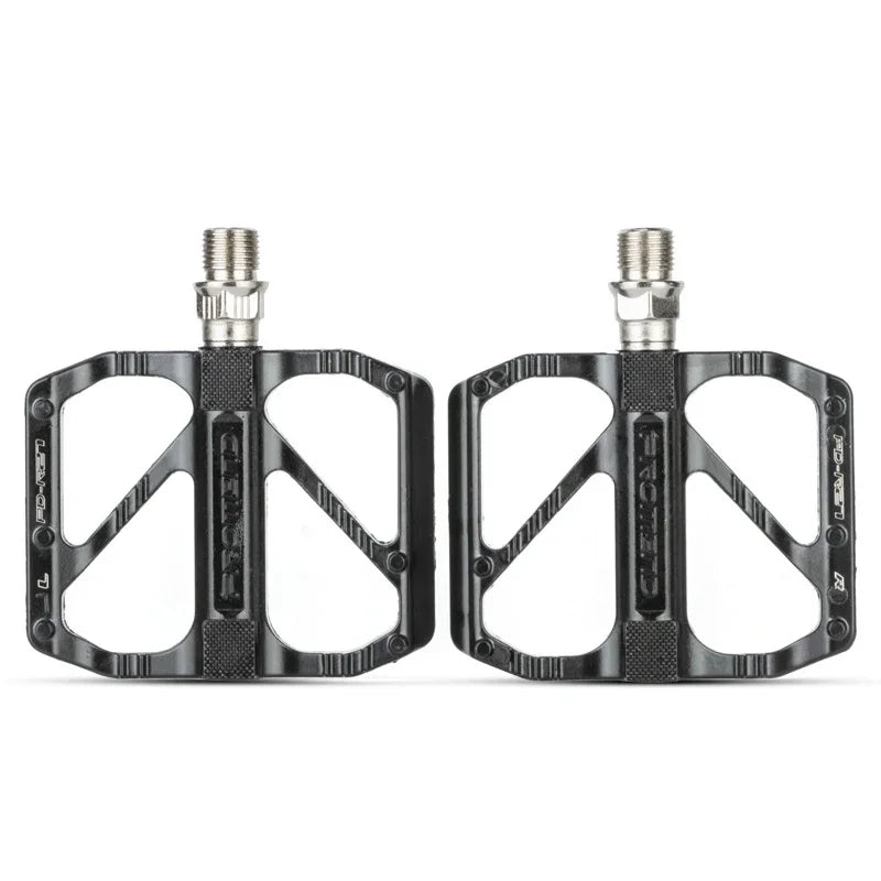 Lightweight non-slip black road bike pedals with DU bearings, ideal for BMX and road bicycles.