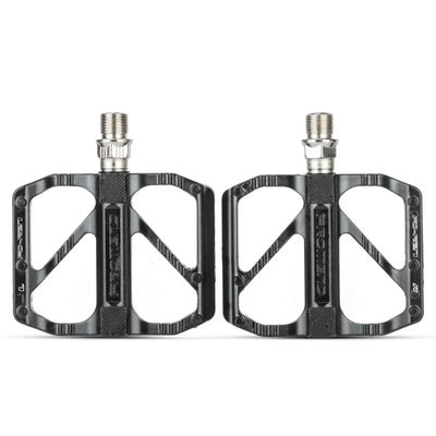 Lightweight non-slip black road bike pedals with DU bearings, ideal for BMX and road bicycles.
