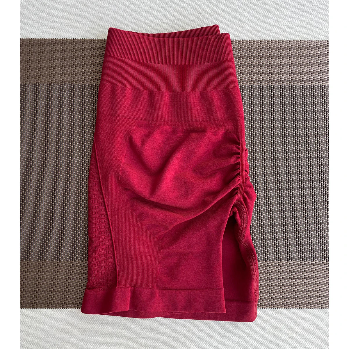 Red seamless contour shorts for women, perfect for workouts, yoga, and gym wear, designed with a straight pocket.