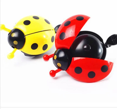 Cartoon ladybug bike bells in yellow and red, perfect mini bicycle horn for kids and girls, made of plastic and aluminum.