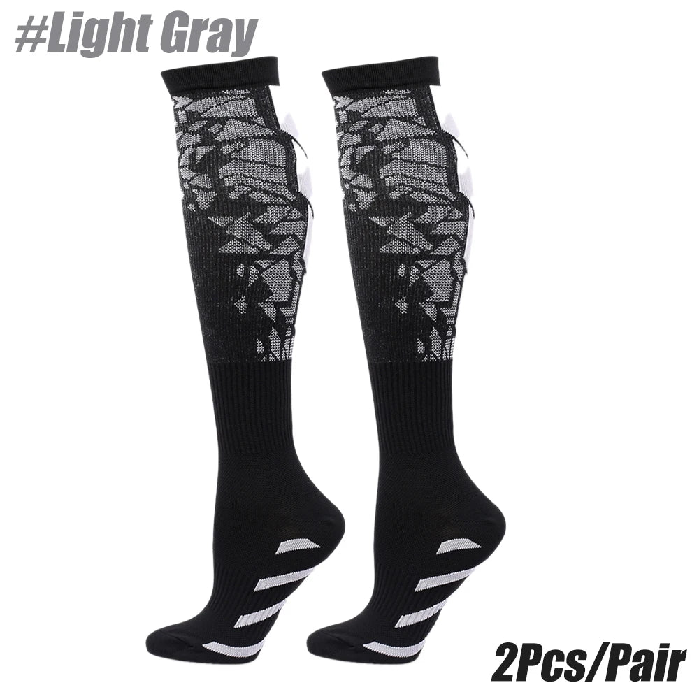 Light Gray compression socks for men and women, designed for calf support during running and sporting activities.
