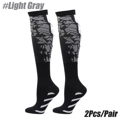 Light Gray compression socks for men and women, designed for calf support during running and sporting activities.