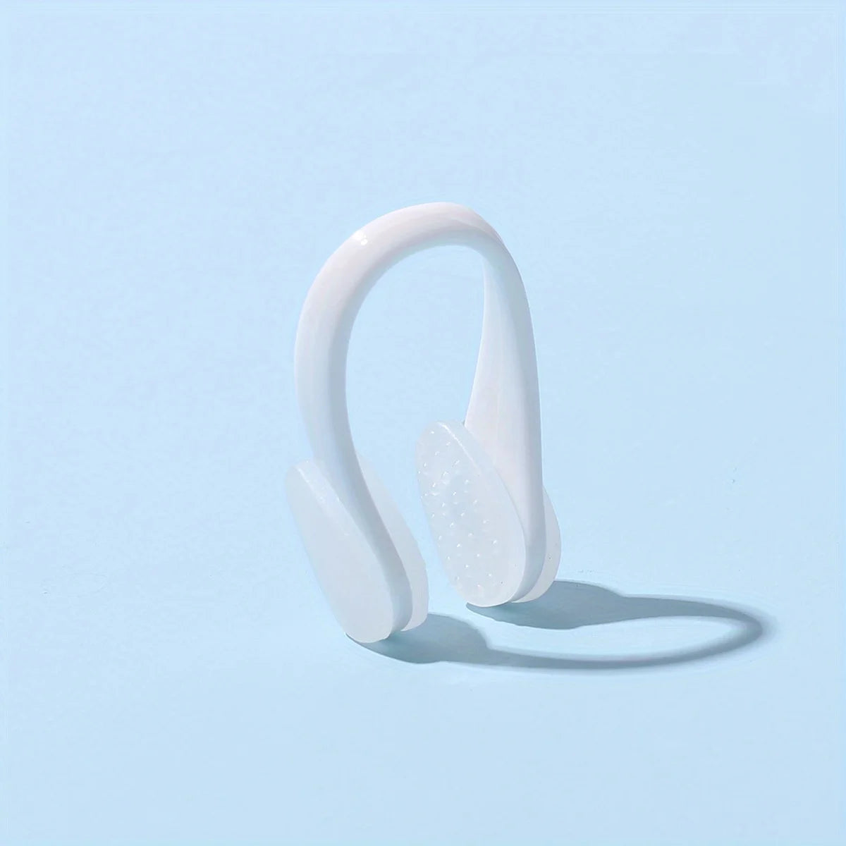 White professional swimming nose clip, comfortable, waterproof, and anti-choking design for effective swimming training.