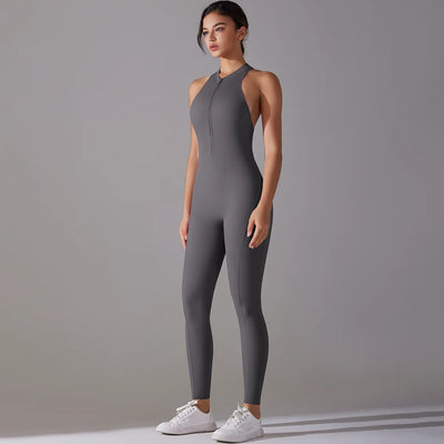 Women in gray bodysuit posing, showcasing a fitted, tummy control design ideal for yoga and workout sessions.