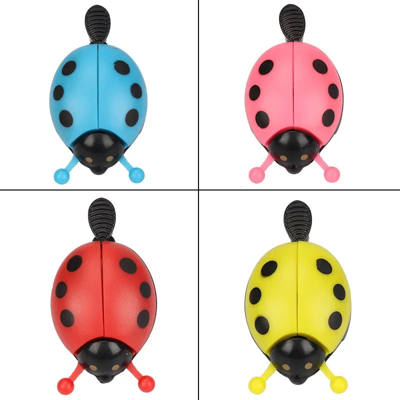 Colorful cartoon ladybug bicycle bells in blue, pink, red, and yellow, perfect for kids' bikes.