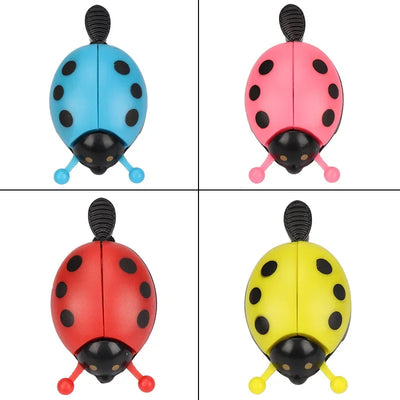 Colorful cartoon ladybug bicycle bells in blue, pink, red, and yellow, perfect for kids' bikes.