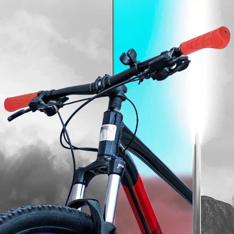 BUCKLOS ergonomic red lock-on bike handlebar grips on a mountain bike, designed for 22.2MM handlebars.