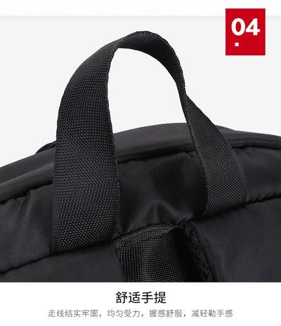 Close-up of the comfortable handle of a unisex black football-themed backpack, designed for easy carrying.