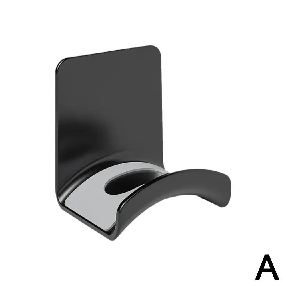 Universal headphone stand wall mount in sleek black plastic for under-desk headset storage.