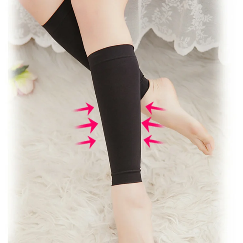 Footless compression calf socks with gradient support for varicose veins and edema, shown on a leg.