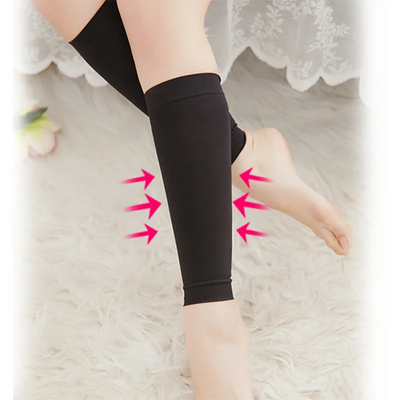 Footless compression calf socks with gradient support for varicose veins and edema, shown on a leg.