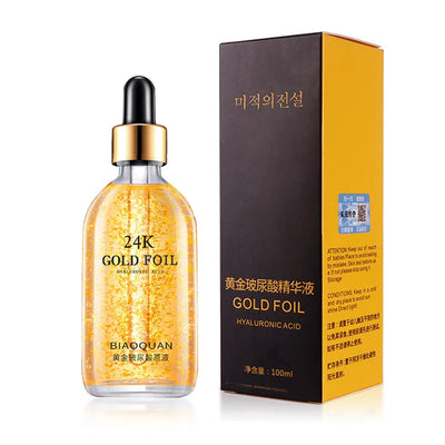 24K Gold Hyaluronic Acid Face Serum bottle with golden foil design and packaging, 100ml, moisturizing skincare product.