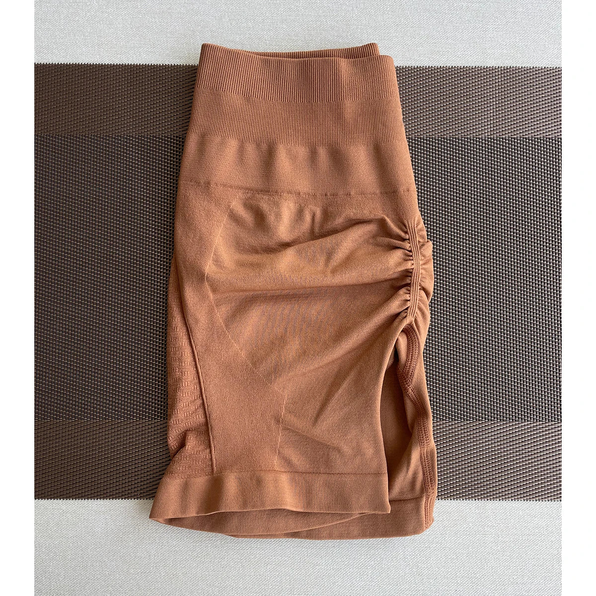 Seamless Amplify contour shorts in brown, made from nylon and spandex, perfect for women's yoga and gym workouts.