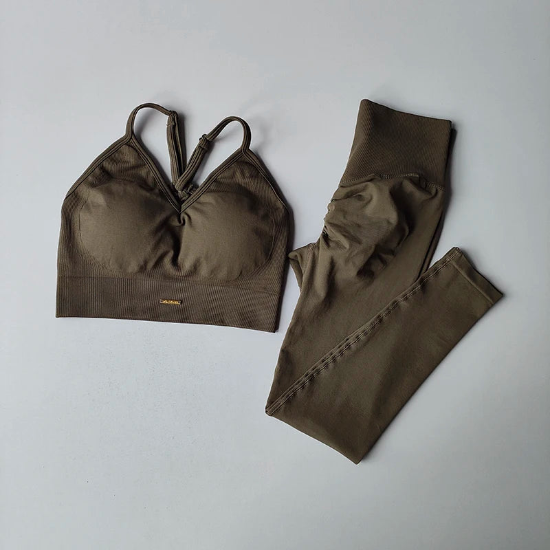 Seamless women's yoga set featuring a V-neck bra and hip-lift leggings in olive green for fitness and toning.