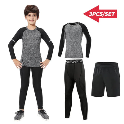 Kids thermal sports set featuring compression tights, long sleeve top, and shorts in gray and black, perfect for winter running.