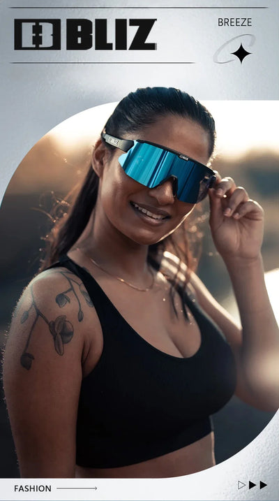 Model wearing BLIZ Breeze polarized cycling sunglasses with UV protection, showcasing sporty style and modern design.
