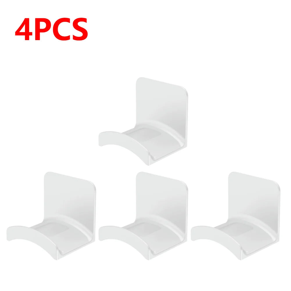Set of 4 white adhesive headphone hangers for wall or desk mounting, perfect for organizing headphones.