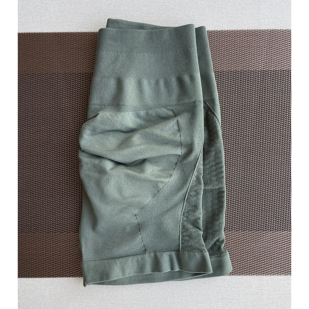 Amplify contour shorts in green, perfect for women’s yoga and gym workouts, featuring a seamless design and straight pockets.