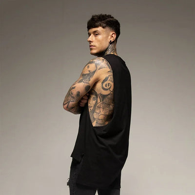 Solid color men's sleeveless shirt for fitness, showcasing a tattooed model wearing cotton gym vest.