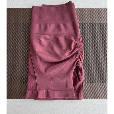 Amplify contour shorts for women in maroon, designed for workout, yoga, and gym wear with a stylish pocket.