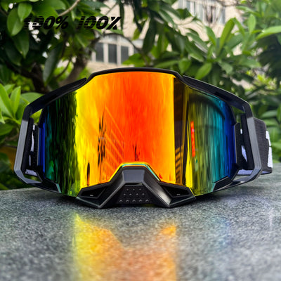 100% IOOX motorcycle goggles with colorful reflective lenses, ideal for off-road MTB cycling and dirt bike racing.