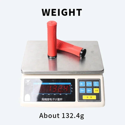 Red BUCKLOS MTB handlebar grips weighing about 132.4g on a digital scale.