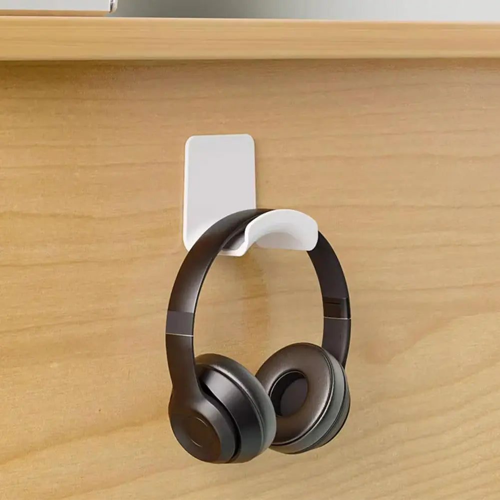 Universal headphone stand adhesive wall mount under desk headset rack holder for gaming earphones.